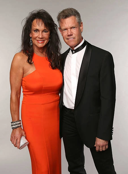 Mary met Randy Travis when she was still married to her first husband